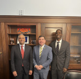 Representative John W. Mannion meets with officials from Micron Technology