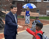 Rep. Mannion First Bumps Child at School