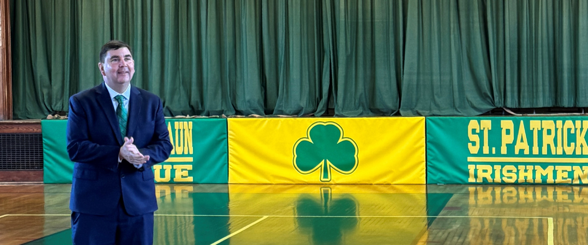 Rep. John Mannion on a basketball court